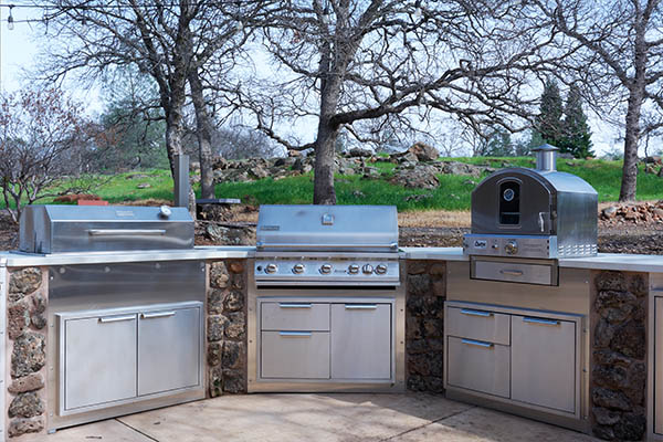 stone tiled outdoor grill area